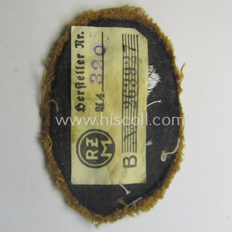 Attractive - and rarely encountered! - hand-embroidred, SA- (ie. 'Sturmabteilungen'-) related officers'-type armbadge (ie. 'Ärmelabzeichen für Führer') as was intended for an: 'SA-Führer' (ie. 'Feldscher o. Arzt') that retains its period 'RzM'-etiket