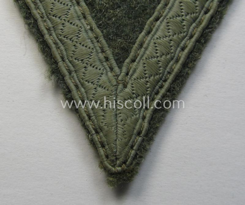 WH (Heeres) 'Armwinkel' (or: arm-chevron) as executed on typical field-grey-coloured wool as was specifically intended for usage by a soldier with the rank of: 'Gefreiter'