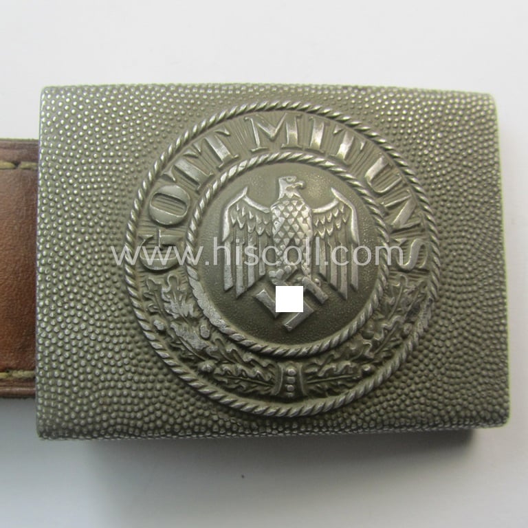 WH (Heeres) 'standard-pattern', field-grey-toned- and aluminium-based belt-buckle being a maker- (ie. 'E. Schneider - Lüdenscheid'-) marked- and/or: '1938'-dated example that comes mounted onto its leather-based tab