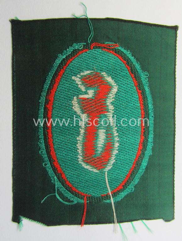 'Sicherheits- u. Hilfsdienst (SHD)' armbadge (ie. 'Ärmelabzeichen') as executed in 'BeVo'-weave pattern, as was intended for an SHD-member who served within the: 'Feuerlöschdienst' (or: fire-extinction-service)