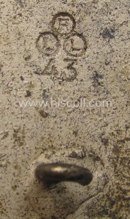 WH (KM) 'Marine-Artillerie-Abzeichen' being a maker- (ie. 'F.L.L. - 43'-) marked- and/or zinc- (ie. 'Feinzink'-) based example by the: 'Friedrich Linden'-company