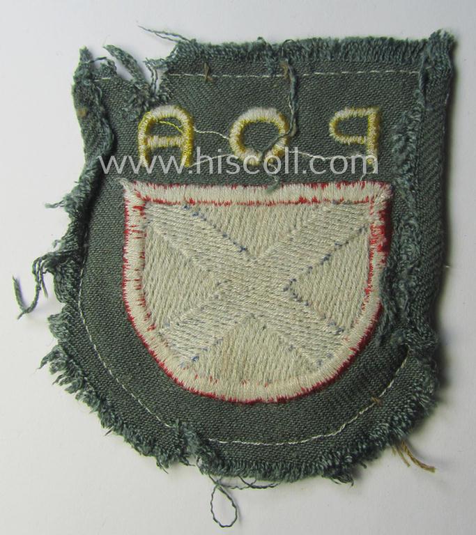 Truly used- and/or worn, multi-coloured and machine-embroidered- (ie. 'variant'-type) armshield as was intended for a Russian volunteer of the 'Russian Liberation Army' (ie. 'POA')