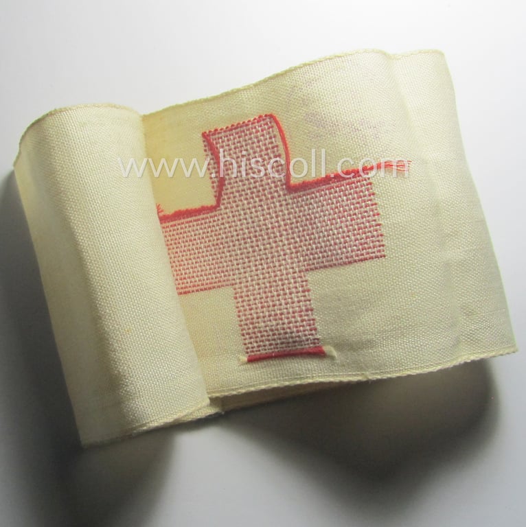 WH (Heeres) related, linnen-based- and/or neatly 'machine-embroidered', beige-white-coloured DRK- (ie. 'Deutsches Rotes Kreuz'-) armband (ie. 'Armbinde') as was intended for the staff-members serving as medical orderly