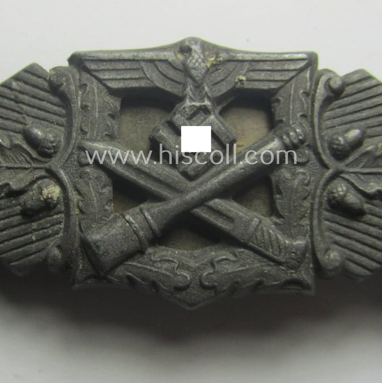 'Nahkampfspange in Bronze' (or: bronze-class close-combat clasp ie. CCC) being a (typical) maker-marked- and/or minimally converse-shaped specimen as was produced by the maker- (ie. 'Hersteller') 'Friedrich Linden' (ie. 'FLL')