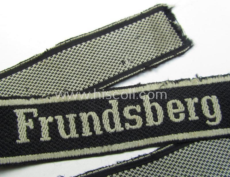 Stunning - and truly worn! - Waffen-SS 1943/44 pattern cuff-title (ie. 'Ärmelstreifen') depicting the machine-woven Latin script text in silver-grey-coloured linnen as was  intended for a member within the: 10. SS-Panzer-Division 'Frundsberg'