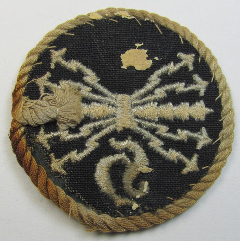 Attractive - albeit clearly used! - example of a WH (Luftwaffe) machine-embroidered, trade- ie. special-career-patch (ie. 'Tätigkeitsabzeichen') having a silver-white-toned 'Kordel' attached as was intended for: 'LW-Horchfunker'-staffmembers