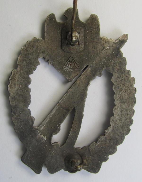 Moderately worn, 'Infanterie Sturmabzeichen in Silber' being a maker- (ie. 'MK' in a triangle-) marked (and/or minimally converse- ie. vaulted-) example by a to date still unidentified maker as was executed in silvered zinc-based metal ('Feinzin...