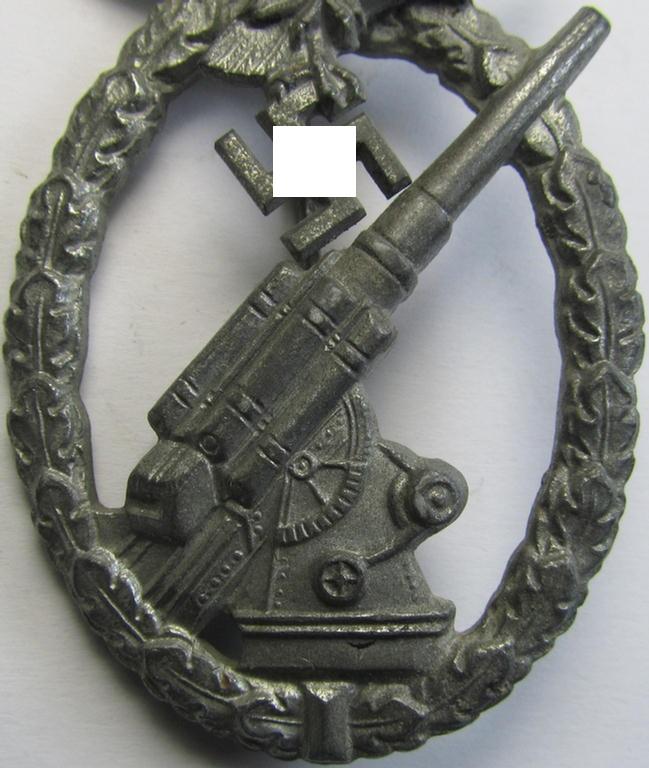 Attractive - and just moderately used! - 'Feinzink'-based example of a WH (Luftwaffe) 'Flakkampfabzeichen' (or: airforce anti-aircraft badge) being a very detailed albeit non-maker-marked example as was produced by the: 'E. Ferd. Wiedmann'-comp...