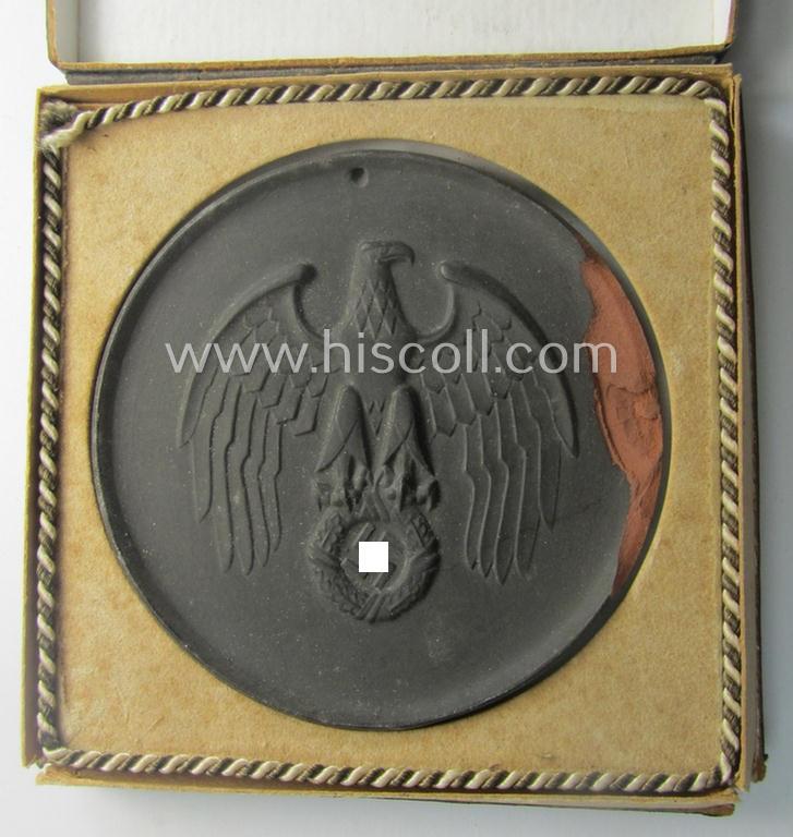 Regrettably damaged, earthenware (ie. 'Allach'-produced!): 'SS-Siegerplakette' as was issued during the: 'Sommer Sonnenwendwettkämpfen der SS' held in 1939 and that comes stored in its period, carton-based box as issued