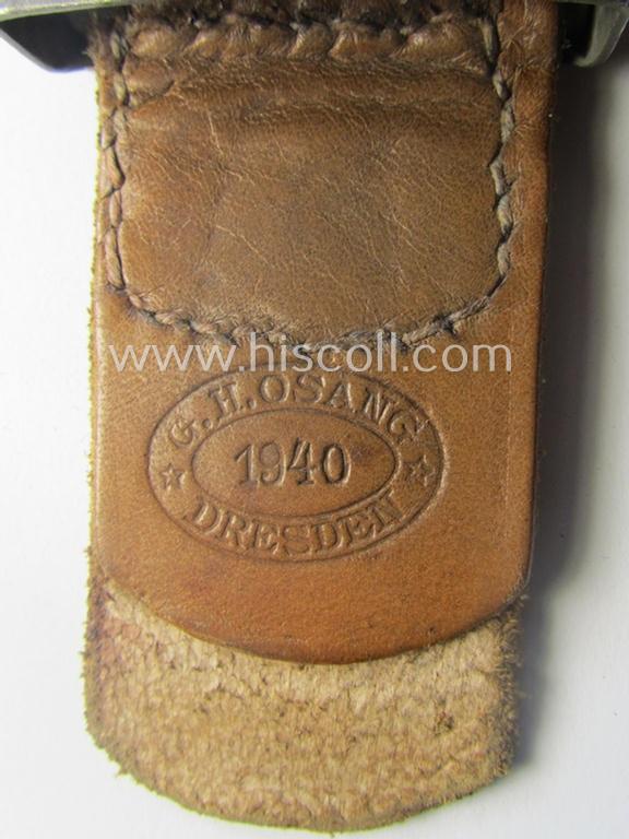 'Virtually mint', 'standard-issue'-pattern, WH (Heeres) field-grey-toned- and steel-based belt-buckle being a non-maker-marked example that comes mounted onto its 'G.H. Osang'-marked and/or '1940'-dated tab