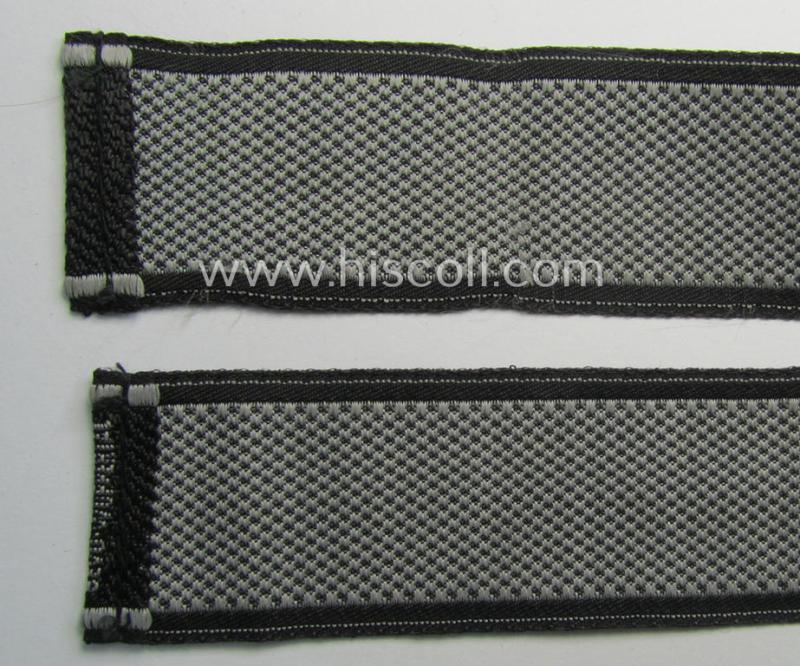 Waffen-SS, 1943-pattern cuff-title (ie. 'Ärmelstreifen') depicting the ('BeVo') machine-woven, Latin script text in silverish-grey linnen as was intended for a member of the: '8. SS-Kavallerie-Division “Florian Geyer”