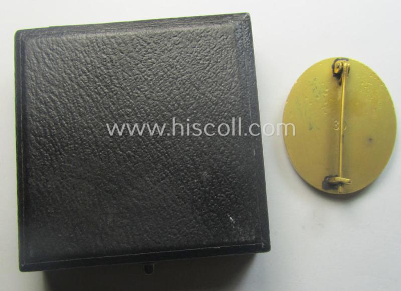 'Verwundeten-Abzeichen in Gold' being a maker- (ie. '30'-) marked- and typical 'Buntmetall'-based example that comes stored in period etui as issued