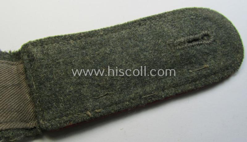 Attractive - albeit clearly used and regrettably single! - WH (Heeres) 'M43'-pattern, EM-shoulderstrap as was intended for usage by a: 'Soldat eines (Sturm-)Artillerie-Abteilungs o. Regiments'