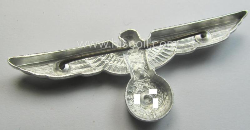 WH (Heeres) bright-silver-toned (ie. aluminium-based), EM- (ie. NCO- or officers') type visor-cap-eagle being a non-maker-marked example that comes in a never used- ie. (I deem) never cap-attached, condition