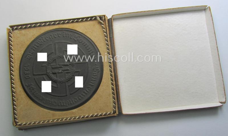 Regrettably damaged, earthenware (ie. 'Allach'-produced!): 'SS-Siegerplakette' as was issued during the: 'Sommer Sonnenwendwettkämpfen der SS' held in 1939 and that comes stored in its period, carton-based box as issued