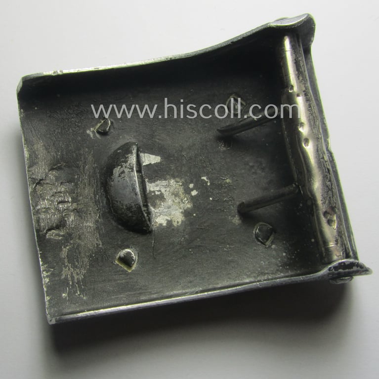 Never before seen, TR-period aluminium-based and youth-related belt-buckle being a non-maker-marked example that was worn by a member of the: 'Schülerlotsendienst - Verkehrswacht'