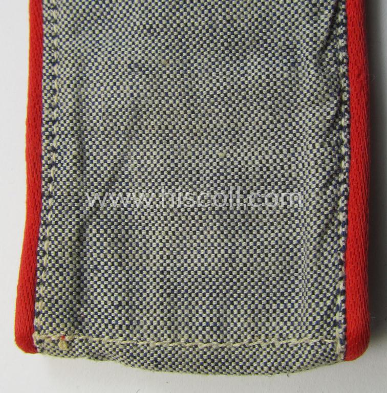 Neat - albeit regrettably single! - WH (LW) EM-type: 'Flakartillerie' shoulderstrap as was specifically intended for the bluish-grey (ie. 'blaumelliertes') summer-shirt and that comes in an overall nice- (albeit moderately used- ie. worn-), condi...