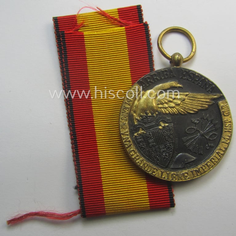 Spanish-issued, Spanish Civil-War commemorative-medal called: 'Medalla de la Campaña 1936-1939' that came together with its period piece of ribbon (ie. 'Bandabschnitt') as issued and/or recently found