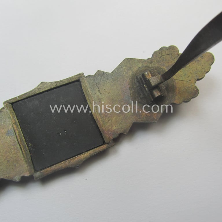 'Nahkampfspange in Bronze' (or: bronze-class close-combat clasp ie. CCC) being a maker- (ie. 'F.&B.-L.'-) marked- and/or minimally converse-shaped specimen as was produced by the maker- (ie. 'Hersteller') 'Funcke u. Brüninghaus'