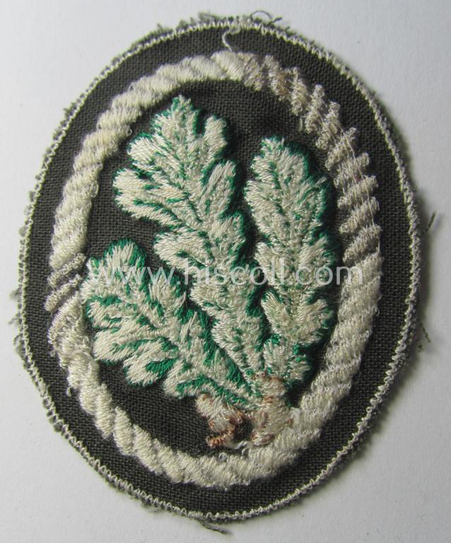 WH (Heeres) 'Jäger'-arm-badge being a desirable 'variant-pattern'-example as was executed in the machine-embroidered style on a thin-shaped- and/or linnen-based background