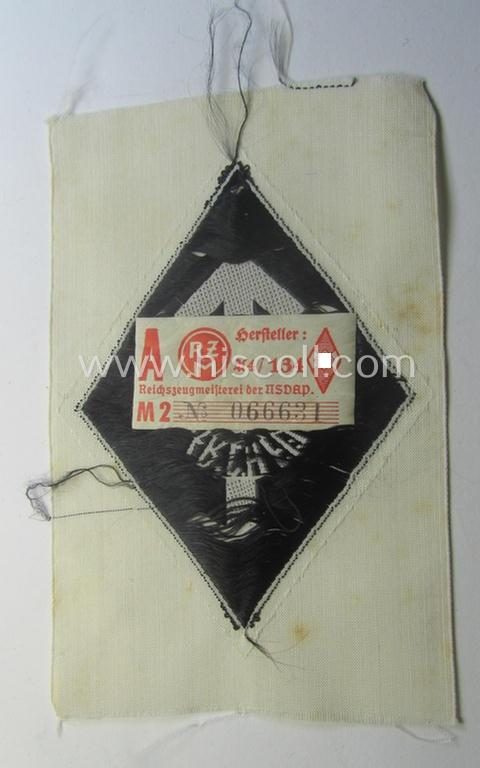 HJ- (ie. 'Hitlerjugend') 'Leistungsabzeichen in Schwarz in Stoff' that retains its 'RzM'-etiket