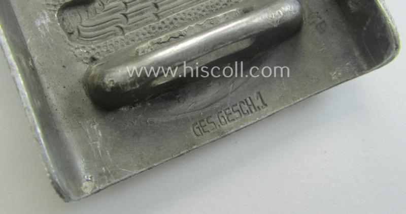 Aluminium-based, so-called: DRK (ie. 'Deutsches Rotes Kreuz'), enlisted-mens'- (ie. NCO-) type belt-buckle being a clearly maker- (ie. 'Ges.Gesch. 1'-) marked example