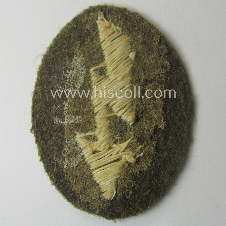 WH (Heeres) 'tropical-styled', trade- and/or special-career insignia (or: 'Signal Blitz') as was intended for a soldier within the: 'Heeres-Flak-Artillerie-Trpn.'