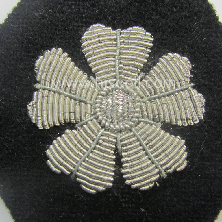 Superb, 'SS'-related sleeve-diamond (ie.: 'Ärmelraute für Führer im Gerichtsdienst') being a very detailed- and hand-embroidered example that still retains its period, paper-based: 'RzM'-etiket