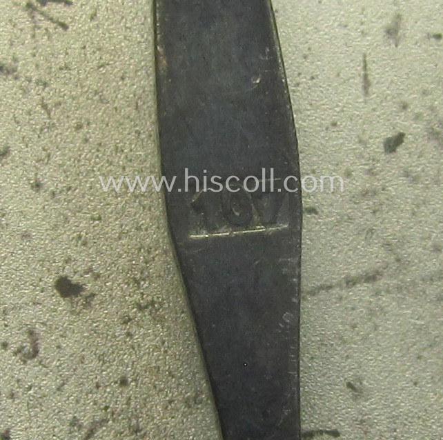 Scarcely found, 'Eisernes Kreuz 1. Klasse' (ie. Iron Cross 1st Class) being a maker- (ie. '107'-) marked example as was produced by the company: 'Carl Wild - Hamburg'