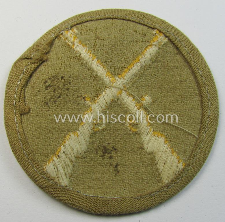 WH (Heeres) 'tropical'-issue, trade- and/or special-career insignia (ie. machine-embroidered 'Laufbahn- o. Tätigkeitsabzeichen') as was intended for an army: 'Waffenmeister' (or weapon-equipment NCO)