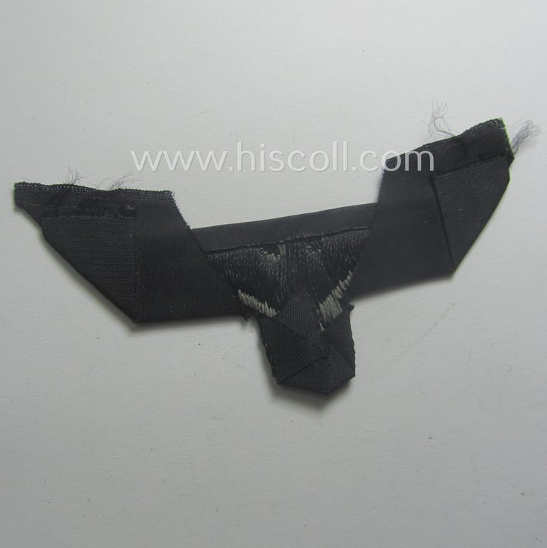 WH (Heeres) later- (ie. mid-war-) period- and/or bluish-grey-coloured 'Panzer'-type side-cap-eagle a executed in the neat 'BeVo'-weave pattern onto a typical black-coloured background