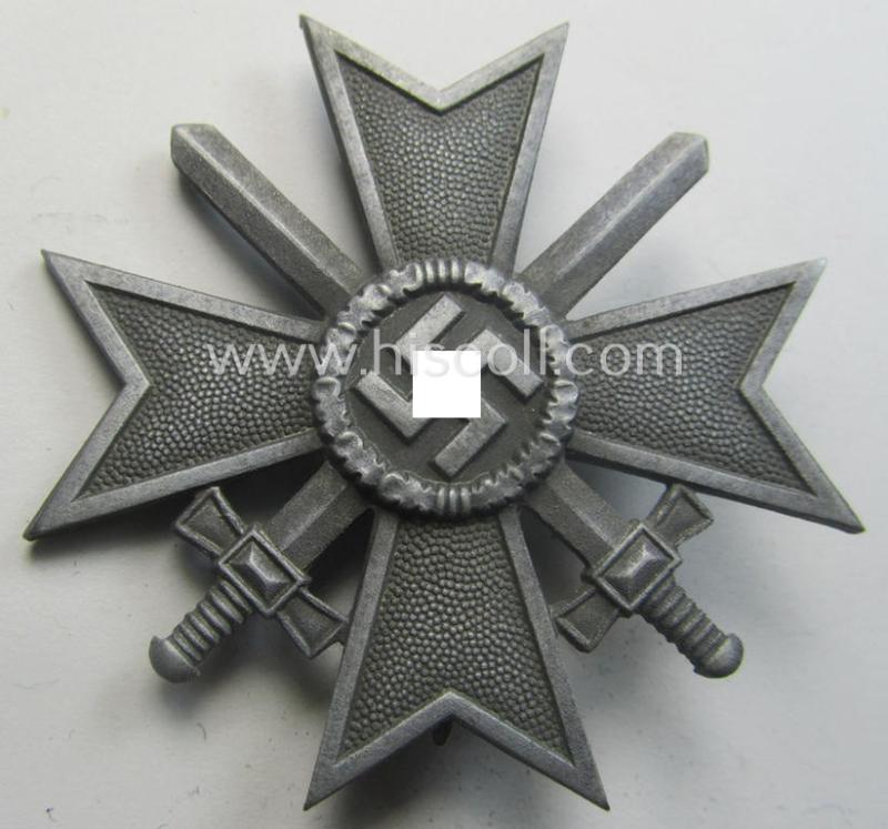 'Kriegsverdienstkreuz 1. Klasse mit Schwertern' being a non-maker-marked specimen by a (by me) unidentified maker as executed in silverish-grey-coloured and/or typical zinc-based metal (ie. 'Feinzink')