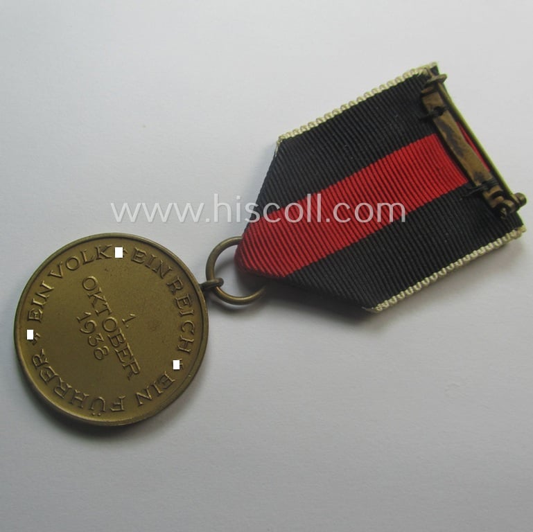 WH Czech-occupation- (ie. 'Anschluss'-) medal: '1. Oktober 1938' that comes mounted onto its period ribbon and that shows a firmly (and period!) attached 'Prager Burg-Spange'