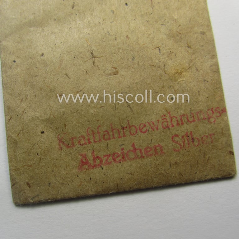 WH (Heeres, LW ie. Waffen-SS-) so-called: 'Kraftfahrbewährungs-Abzeichen in Silber' being a 'virtually mint' example as was produced by the Austrian-based maker: 'Rudolf Souval - Wien VII/62' and that came stored in its 'Zellstoff'-based pouch