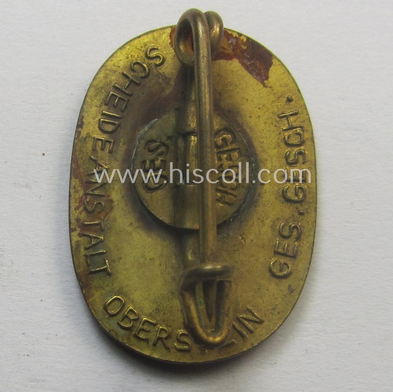 Bright orange-coloured and neatly enamelled 'Reichsarbeitsdienst'- (ie. RAD-) related lapel-pin (ie. 'Ehrennadel') entitled: 'Arbeitsdank' (that shows a makers'- and double 'Ges.Gesch.'-patent-pending-marking on its back)