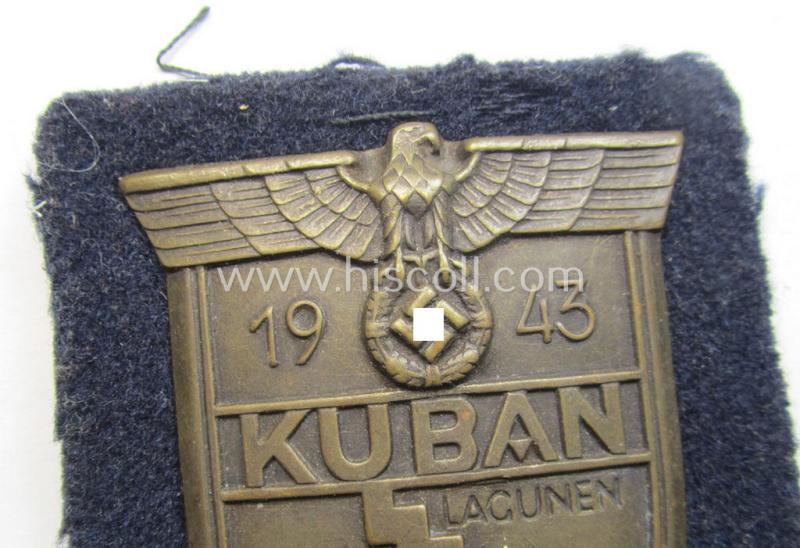 Very attractive - and actually scarcely encountered! - WH (Kriegsmarine)  'Kuban'-campaign-shield that comes mounted onto its original darker-blue-coloured- and/or woolen-based 'backing' as issued and/or used