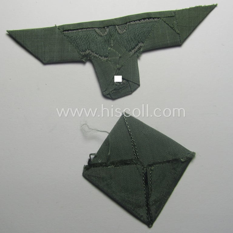 Early- (ie. mid-) war-period, WH (Heeres) cap-eagle & cocarde-set (ie. 'Schiffchenmützen-Adler u. Kokarde-Satz für Mannschaften u. Uffz.') being a 'virtually mint' set as executed in bluish-grey-coloured linnen on a field-grey-coloured background