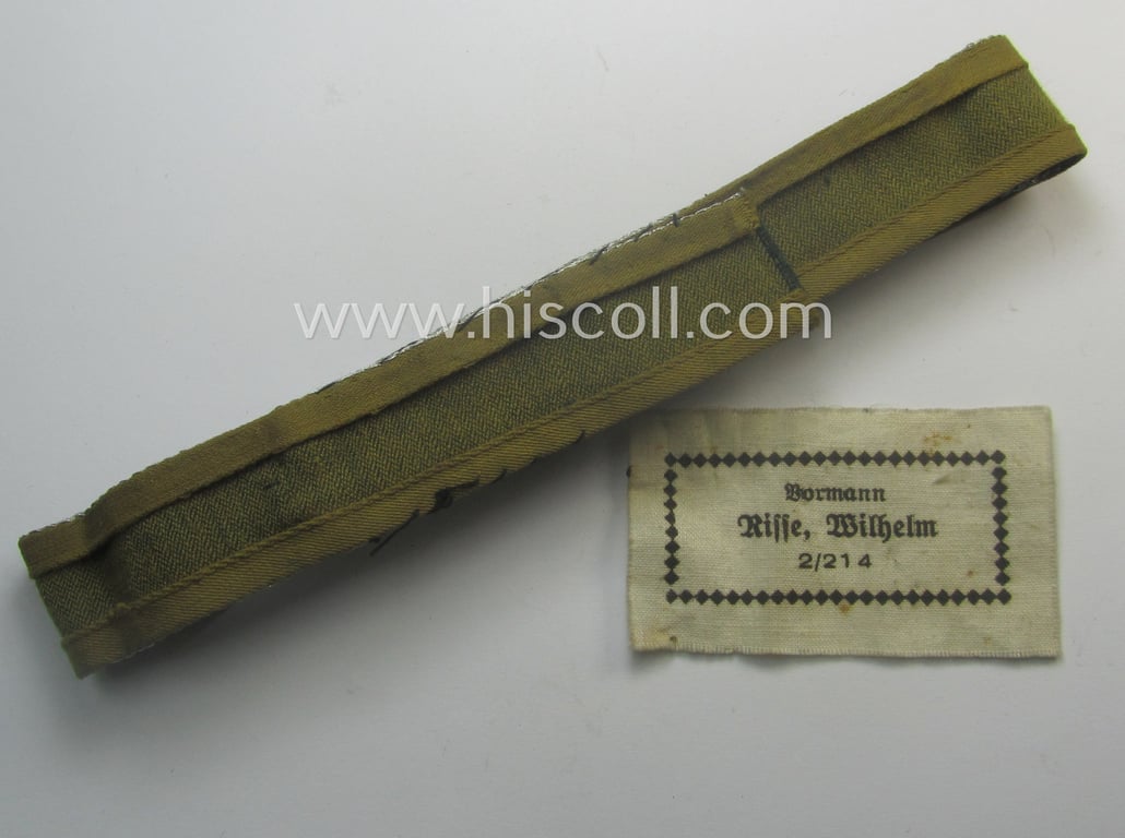 Truly worn, 'BeVo'-like cuff-title (ie. 'Ärmelstreifen') entitled: 'Afrikakorps' being a with certainty issued example that comes in an overall nice- (ie. once tunic-attached-), condition