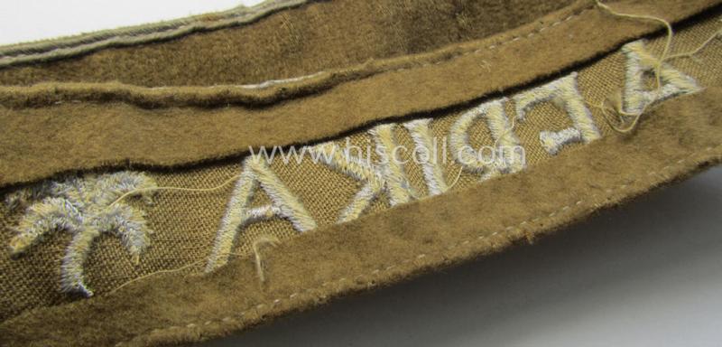 Attractive - and clearly worn! - WH cuff-title (ie. 'Ärmelstreifen') entitled: 'Afrika' (being a minimally shortened example that comes in an overall very nice- (ie. issued and clearly worn ie. once tunic-attached-), condition)