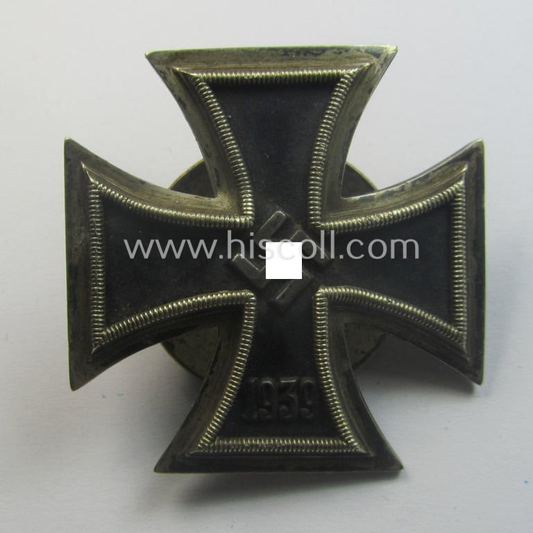 Moderately used, Iron Cross 1st class (or: 'Eisernes Kreuz 1. Klasse') as executed in the scarcely seen so-called: 'screw-back'- (ie. 'An der Schraube'-) pattern being a typical maker- (ie. 'L/16'-) marked example