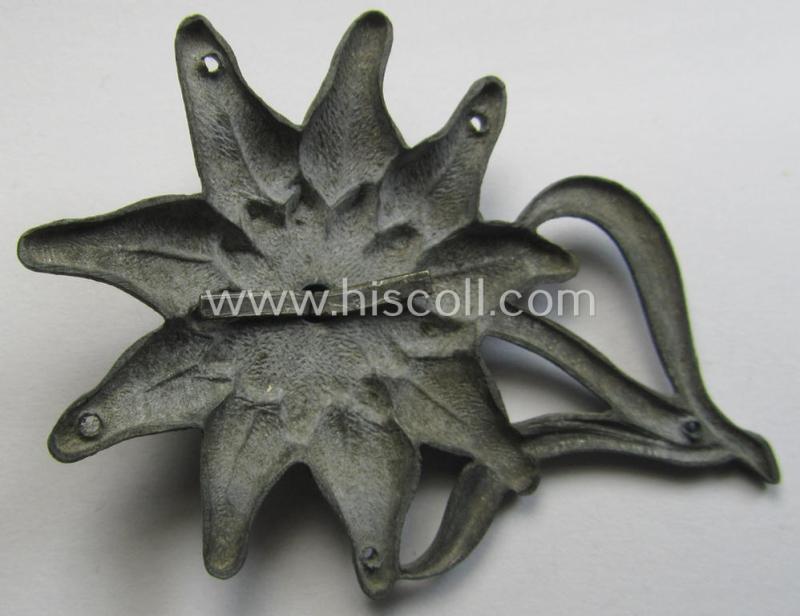 WH (Heeres) silverish-coloured, zinc-based (albeit non-maker-marked): M43-cap-badge (ie. 'Mützenabzeichen')