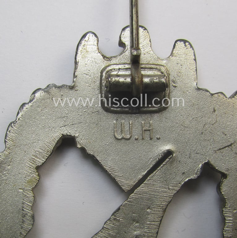 'Infanterie Sturmabzeichen in Silber' being a maker- (ie. 'W.H.'-) marked and/or quite converse, 'solid-back' example by the Austrian-based maker: 'Wilhelm Hobacher' as was executed in bright silver-coloured, zinc-based metal