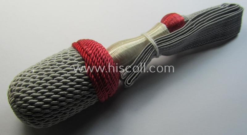 Attractive, red-, white- and red-coloured EM- (ie. NCO-) type side-arm knot (ie. 'Portepee' ie.: 'Troddel') as was used for the various WH-bayonets and that comes in an overall very nice- (ie. 'virtually mint- ie. unissued'-), condition