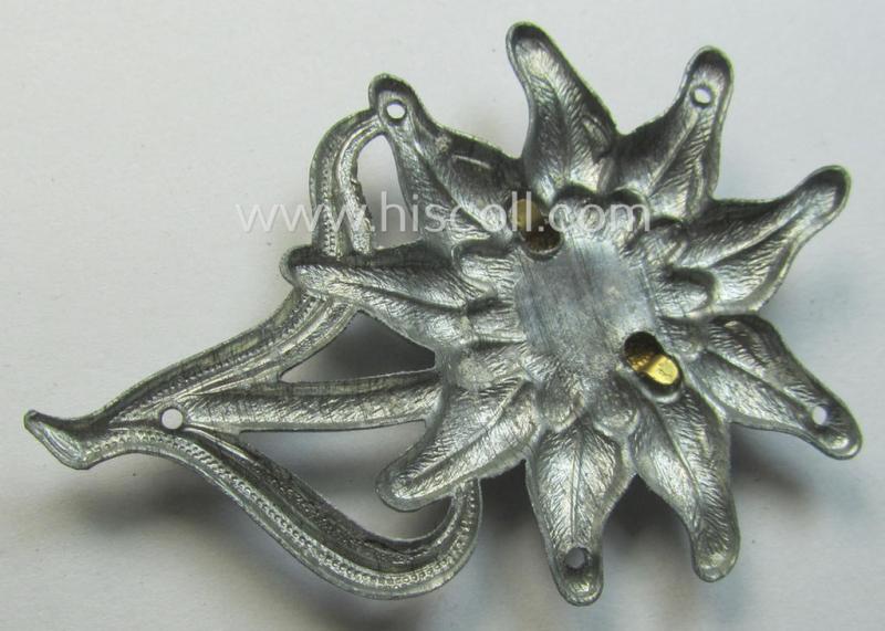 WH (Heeres) (bright) silverish-coloured, zinc-based (albeit non-maker-marked): 'M43'-pattern 'Edelweiss'-cap-badge (ie. 'Mützenabzeichen')
