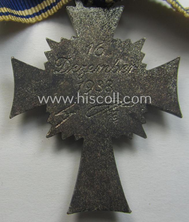 'Ehrenkreuz der deutschen Mutter - zweite Stufe' (or: silver-class mothers'-cross) that came mounted onto its (unusally seen!) 'bow-shaped' ribbon as issued and recently found