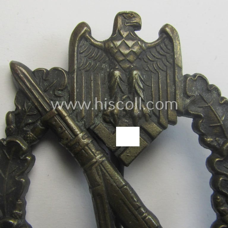 'Infanterie Sturmabzeichen in Bronze' (or: bronze-class infantry-assault badge ie. IAB) being a non-maker-marked,  'oval-crimp'-pattern example as executed in zinc-based metal (ie. 'Feinzink') as produced by the: 'Wilh. Deumer'-company