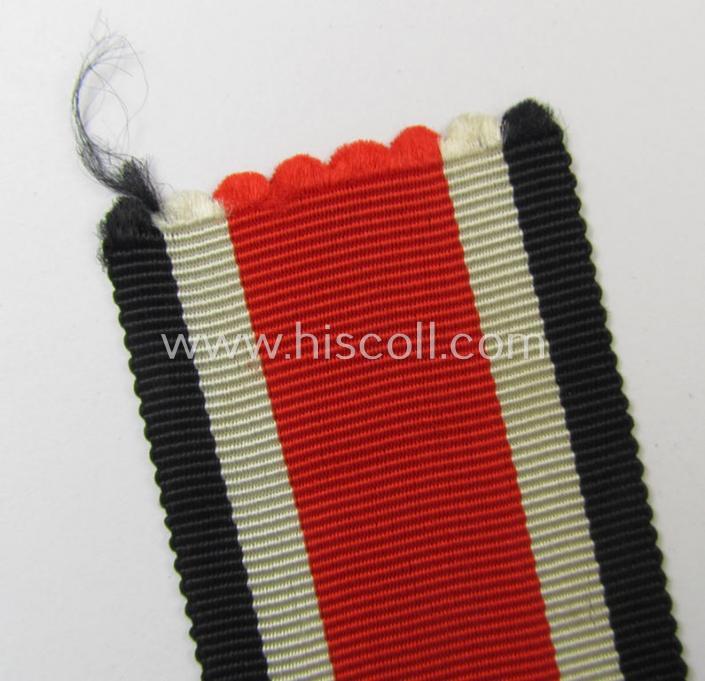 Neat spare-part: a non-confectioned- (ie. full length- ie. 29 cms. long-sized-) ribbon (ie. 'Bandabschitt') as was intended for the: 'Eisernes Kreuz II. Klasse' and that comes in an overall very nice- (ie. 'virtually mint ie. unissued'-), condi...