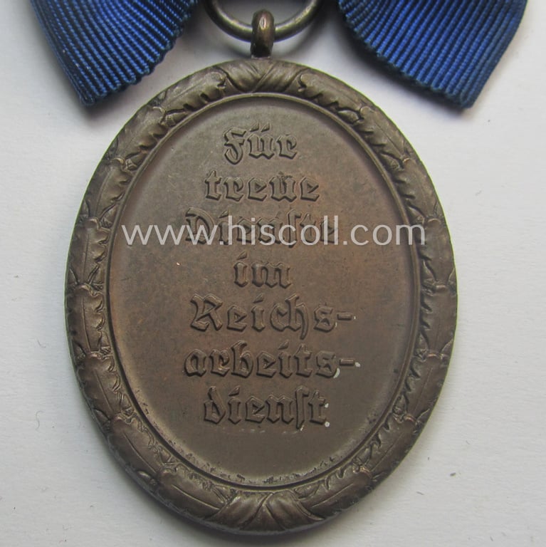 Scarcely encountered example of a: 'Reichsarbeitsdienst der weiblichen Jugend' (or: RADwJ) so-called: 'Dienstauszeichnung der 4. Stf. in Bronze' that comes mounted onto its period ('bow-tie'-shaped) ribbon (ie. 'Bandabschnitt')