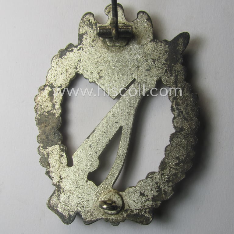 'Infanterie-Sturmabzeichen in Silber' being a non-maker-marked, 'solid-back'- and/or typical zinc- (ie. 'Feinzink'-) based specimen of the so-called: 'egg-head'-pattern (as was presumably produced by the: 'Gustav Brehmer'-company)