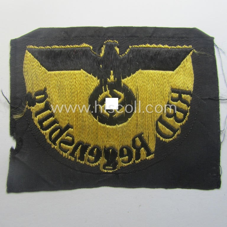 RB- ('Reichsbahn'-) related arm-eagle as executed in 'BeVo'-weave style as was intended for an official of the: 'Deutsche Reichsbahn' ie. the 'RBD Regensburg' (or: 'Reichsbahndirektion Regensburg')